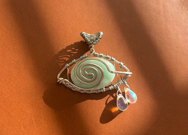 Custom wire-wrapped sea glass shell pendant with moonstone drops