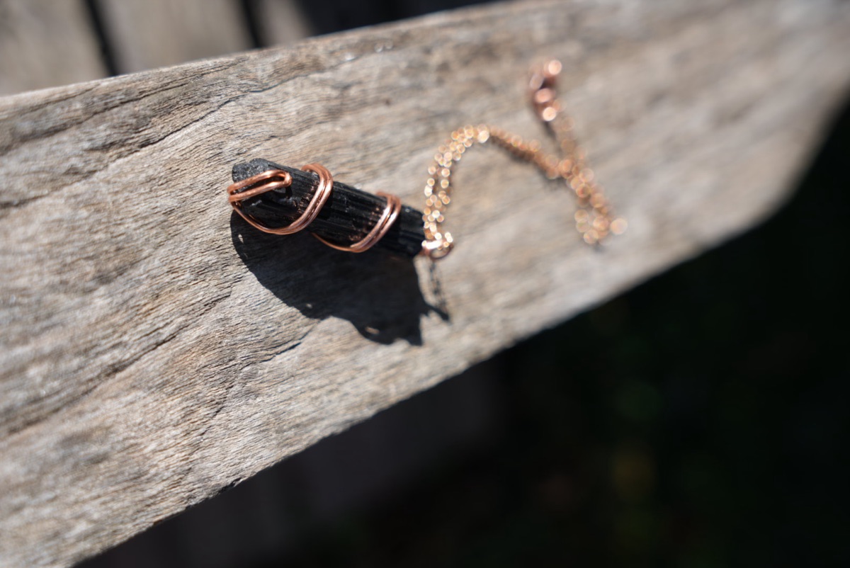 Rough Black Striated Stone on Copper